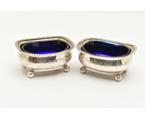 A PAIR OF GEORGIAN SILVER SALTS, rounded rectangular form with gadrooned rims, engraved thistle detailing, raised on four bal