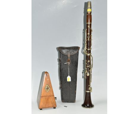 A CASED CLARINET AND A METRONOME, the clarinet does not appear to have a maker's name, with hard leather case, and Maelzel me