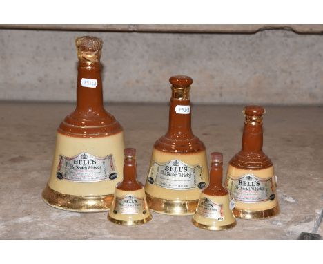 BELL'S WHISKY, Five Bell's Whisky Wade Decanters in descending order of size from 26 2/3 fl.oz.,contents vary