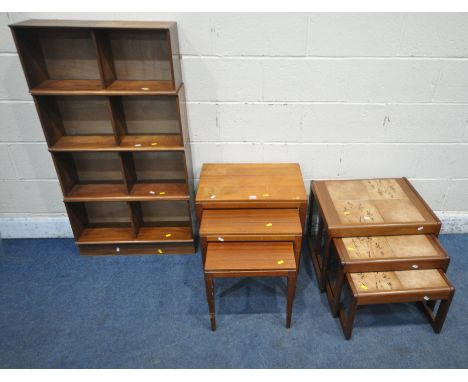 A MID CENTURY TEAK NEST OF THREE TABLES, raised on square tapered legs, largest table width 54cm x depth 38cm x height 51cm, 
