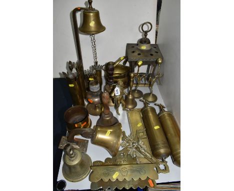 A GROUP OF BRASSWARE, comprising two trench art shell case vases, a shell case planter, six brass bells, two brass finger boa
