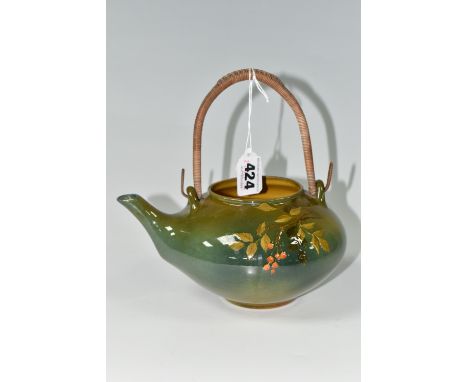 A ROOKWOOD POTTERY TEAPOT, date marked for 1894, the exterior painted with fruiting branches on a graduated green ground, yel