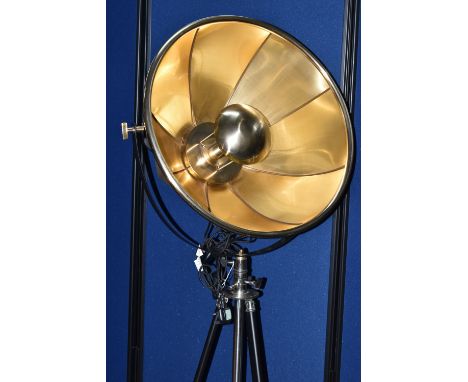 A REPRODUCTION BLACK AND BRASS FINISH TRIPOD FLOOR LAMP, with a large half dome shade, max height 194cm x min height 167cm, c