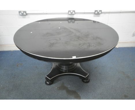 A LARGE EBONISED CIRCULAR DINING TABLE, on a cylindrical pillar, shaped base on bun feet, diameter 151cm x height 80cm (condi