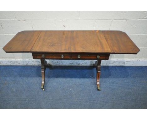 A GEORGIAN MAHOGANY DROP LEAF SOFA TABLE, with two frieze drawers, raised on twin supports and shaped legs, with brass caps a