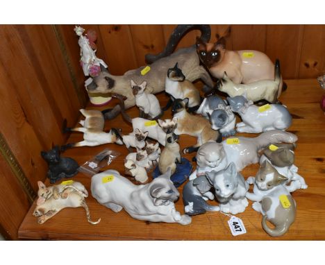 A LARGE GROUP OF ORNAMENTAL CATS to include a group of four Lladro cats comprising two No. 5114 Surprised Cat figures,  No. 5