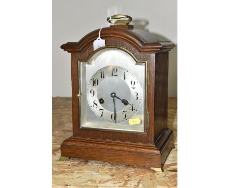 AN EARLY TWENTIETH CENTURY JUNGHANS WURTTEMBERG CLOCK, a wood mantle clock, open with the door at the back, it has Junghans W