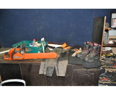 A HUSQVARNA 445 X-TORQ PETROL CHAINSAW AND A TRAY CONTAINING OILS , FILES AND PPE including two pairs of Oregon Yukon chainsa