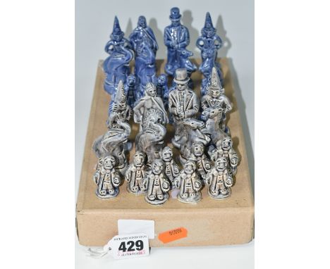 A CERAMIC CIRCUS THEMED CHESS SET, all thirty two pieces are present with box, blue glazed pieces to include clowns, ringmast