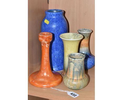 A GROUP OF FIVE PIECES OF RUSKIN POTTERY, comprising an orange lustre candlestick, dated 1921, height 16.5cm and four vases o