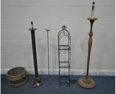 A WROUGHT IRON STANDARD LAMP, along with a metal stand, candle stand, grain bucket, and another standard lamp (condition repo