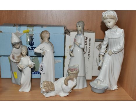 A GROUP OF LLADRO AND NAO FIGURINES, comprising Lladro Girl with Hands Akimbo no 4872, sculptor Fulgencio Garcia, issued 1974