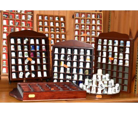 A COLLECTION OF THIMBLES, to include over two hundred and ninety thimbles in eight display cases/stands, mainly ceramic souve