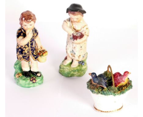 A PAIR OF SMALL LATE EIGHTEENTH/EARLY NINETEENTH CENTURY DERBY PORCELAIN FIGURES one of a little girl spooning food from a bo