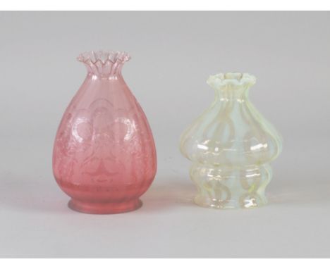 A VASELINE GLASS LIGHT SHADE WITH FRILLED RIM, 6" (15.2cm) high, together with an CRANBERRY EXAMPLE, 7" (17.8cm) high (2)