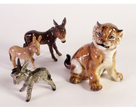 A W. GOEBEL MODEL OF A DONKEY, ANOTHER of  A FOAL, a Beswick model DONKEY and an Italian model Leopard cub (4) 