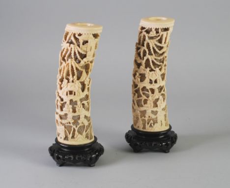 PAIR OF LATE NINETEENTH/EARLY TWENTIETH CENTURY CHINESE PIERCED IVORY TUSK VASES, typical form, intricately worked with figur