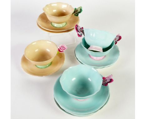 FIVE PARAGON CHINA TEA CUPS, four with butterfly handles, one with a flower handle, together with eight saucers (13) 