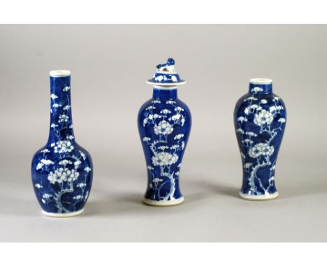 THREE PIECE CHINESE BLUE AND WHITE PORCELAIN VASE GARNITURE, decorated with prunus on cracked ice grounds comprising, bottle 