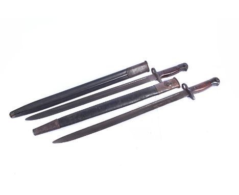 A Unit marked Wilkinson 1907 SMLE bayonet, stamped 3 WK 1942 with scabbard, together with another Unit marked SLW 1907 bayone