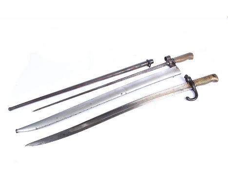 A French Lebel bayonet, with cruciform blade, marked J and M both in circles, with scabbard, together with a French Chassepot