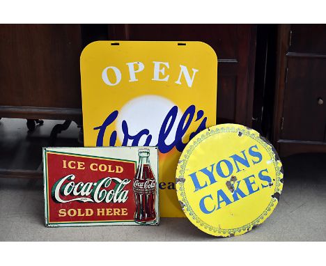 A vintage Lyons Cakes circular enamel sign, together with a Coca-Cola sign and a Walls Ice Cream sign (3)