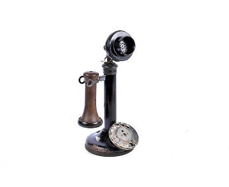 A telephone, a black candlestick type with oxidised fittings, marked PL30, 234 and No. 150, with chromium dial (no wires)