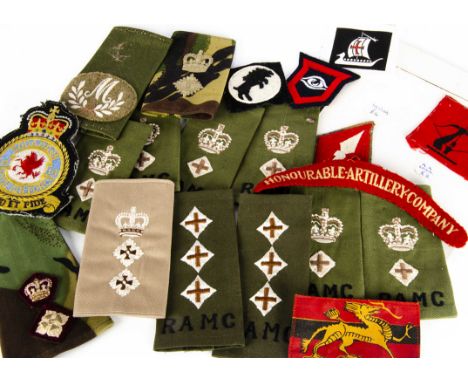 A collection of cloth badges and epaulettes, including RAMC, Gurkhas, HAC and more, plus a selection of Overseas examples (pa