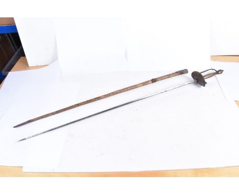 A 19th Century Continental Court sword, with a triangular hollow blade, brass grip and guard, with engraved design, complete 