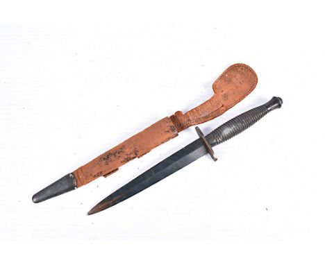 A WWII period 3rd pattern Fairbairn Sykes dagger, marked 3 to the handle, cross guard unmarked, together with leather a metal