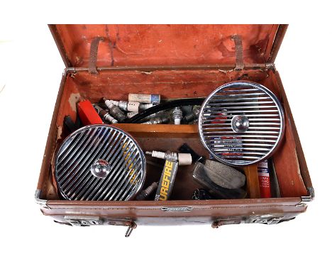 A pair of vintage car light covers, together with a selection of spark plus, and other motoring items (parcel)