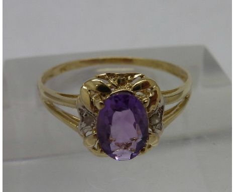 A 9ct gold, amethyst and diamond ring, weight 0.9g, size O