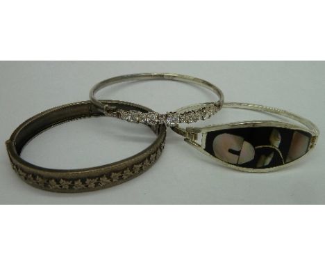 A Victorian silver bangle, Birmingham 1889, and two other silver bangles, weight 33g