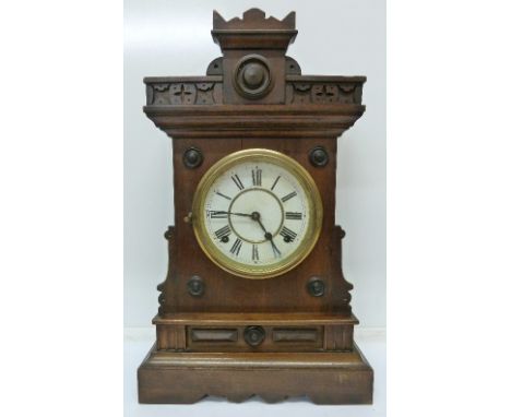 A walnut mantel clock with striking movement