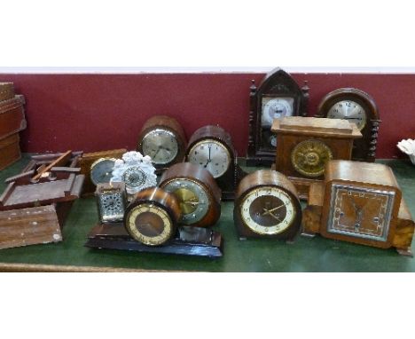 A collection of twelve mantel clocks and a barometer including Enfield, Smiths, some with chiming movements