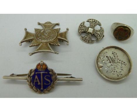 A sterling silver ring with Chinese inscription marked Birks, a silver badge, a silver Celtic badge, a silver cross badge wit