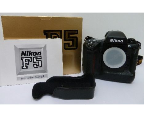 A Nikon F5 camera body, with ERC base cover and instruction book, boxed, no batteries