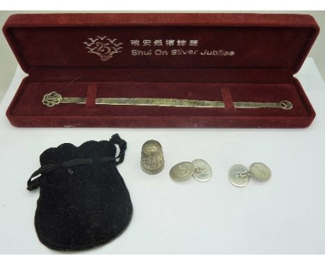 A pair of silver cufflinks, a silver letter opener and a thimble