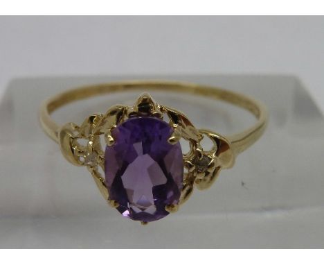 A 9ct gold, amethyst and diamond ring, weight 0.9g, size O