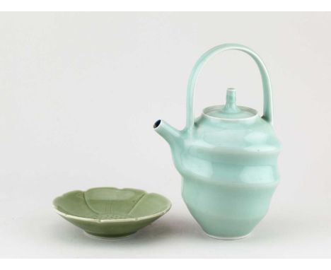 † DEREK EMMS (1929-2004); a small porcelain dish with scalloped rim covered celadon glaze, impressed DE mark, diameter 13cm, 