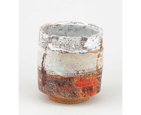 † ROBIN WELCH (1936-2019); a cylindrical stoneware vessel covered in bands of mottled white crackle, pale yellow and rusty gl