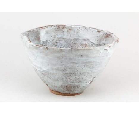 † ROBIN WELCH (1936-2019); a deep stoneware bowl covered in pale grey glaze with lilac highlights, impressed RW mark, diamete