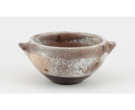 † SVEND BAYER (born 1946); a wood fired stoneware bowl with lug handles covered in shino and ash glaze, diameter 18cm.Provena