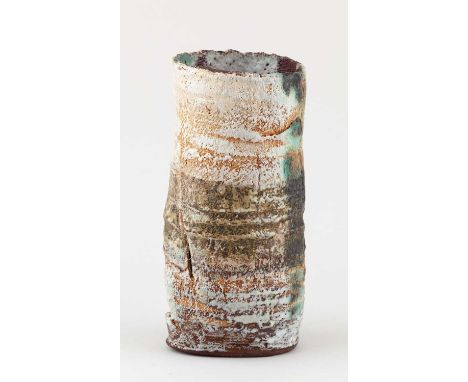 † RACHEL WOOD (born 1962); a cylindrical stoneware vessel with textured surface covered in layered slips and glaze, incised W