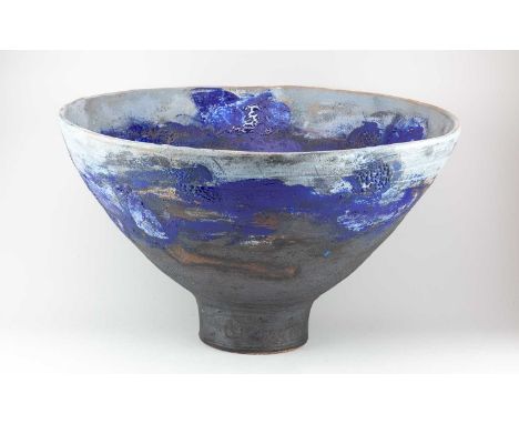 † ROBIN WELCH (1936-2019); a very large stoneware pedestal bowl covered in bronze and grey glaze with dark blue enamel decora