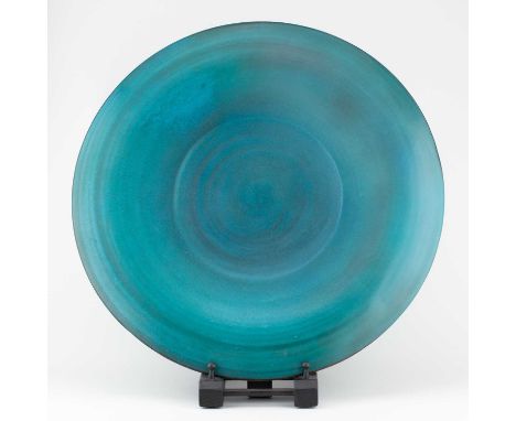 † ABDO NAGI (1941-2001); a large porcelain charger/wall hanging covered in turquoise glaze with bronze rim, impressed mark, m