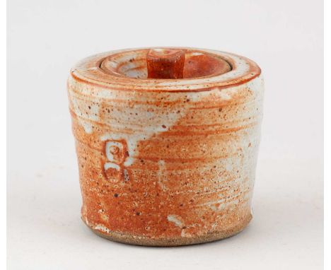 JOHN REEVE (1929-2012) for Longlands Pottery; a small stoneware caddy covered in shino glaze, impressed marks, height 8.5cm.C