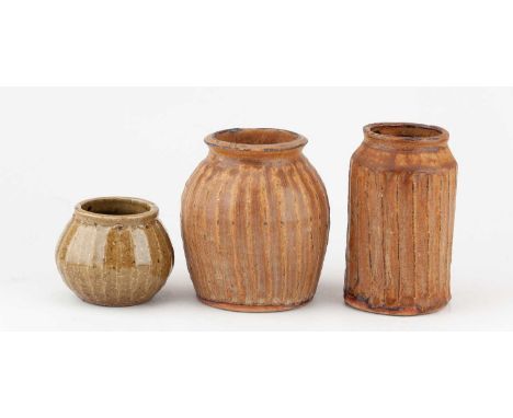† SYLVIA HARDAKER (1930-2023) for Leach Pottery; a trio of fluted stoneware pots, impressed SH and pottery marks, tallest 12.