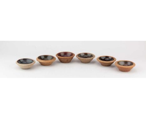 Leach Pottery; a set of six stoneware pin dishes, impressed pottery marks, diameter 8.5cm (6).Condition Report: Tight hairlin