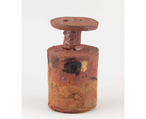 † ROBIN WELCH (1936-2019); a cylindrical stoneware bottle with narrow neck and disc rim covered in rusty glaze with black ena